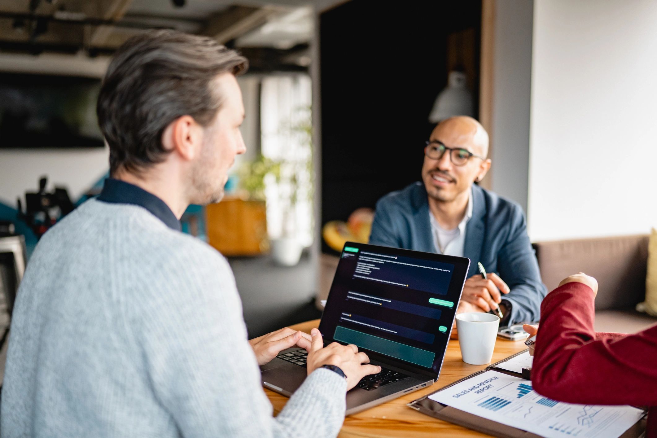 Business team planning workflow together in an office meeting